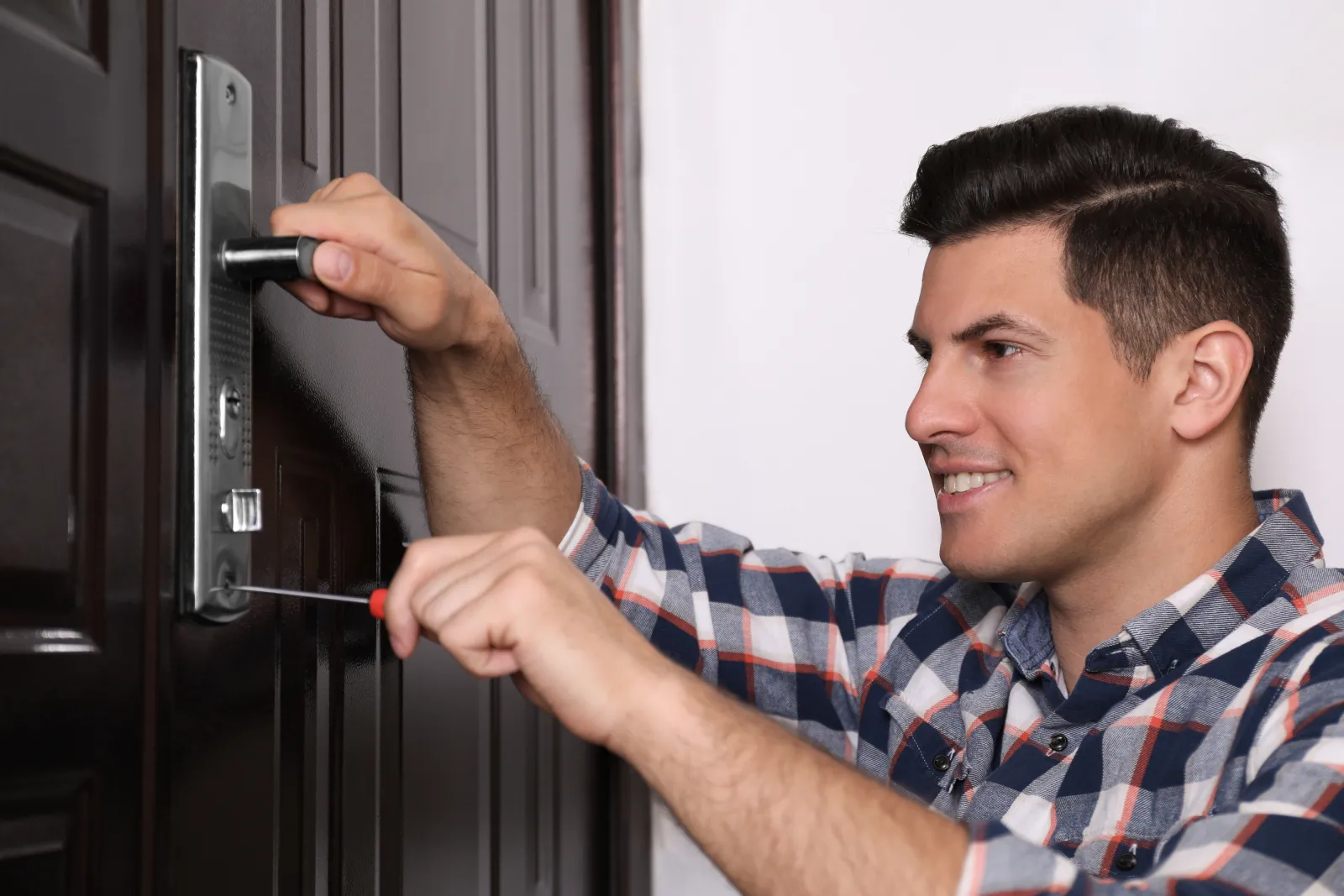 24-hour-locksmith-phoenix-az-door-lock 24 Hour Locksmith in Phoenix, Arizona — a locksmith working on a door lock during an emergency call in Phoenix, Arizona.