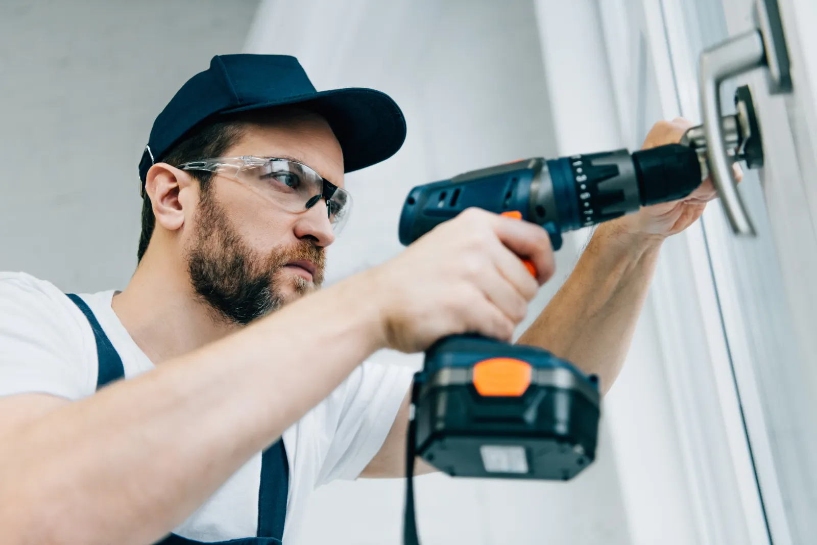24-hour-locksmith-phoenix-az-lockout A 24 hour locksmith opening a locked door with proper bypass tools during an after-hours lockout call at a Phoenix property.