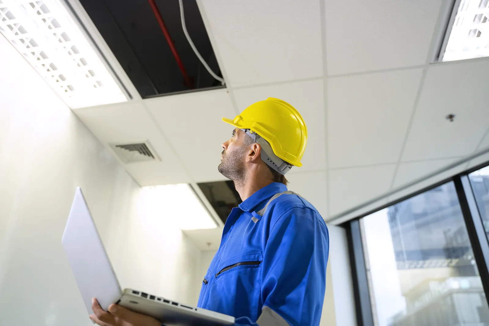 commercial-electrical-contractors-phoenix-az-building A commercial electrician on the job at a Phoenix-area business, one of the Valley properties where ShowUp Promise connects owners with a commercial electrical contractor.