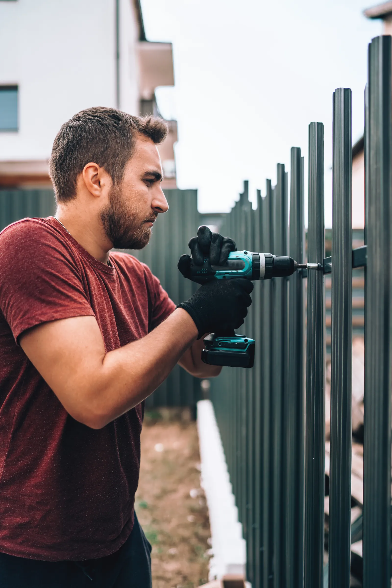 fence-company-phoenix-az-install A fencing crew setting posts and building a new fence at a Phoenix, Arizona home, digging footings and bracing posts against the hard desert soil.