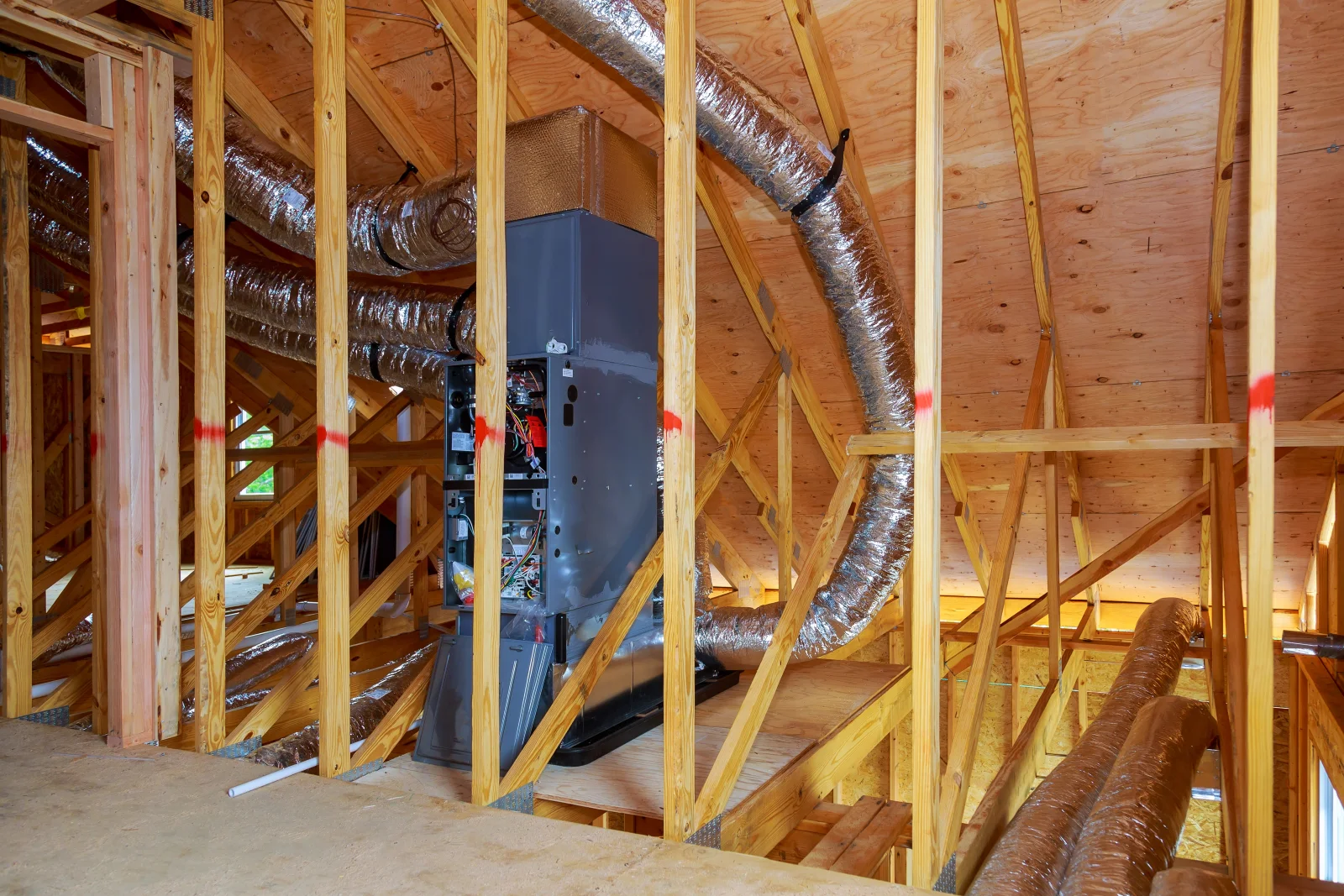 A new furnace unit installed on an attic platform in a Phoenix home during a furnace replacement.