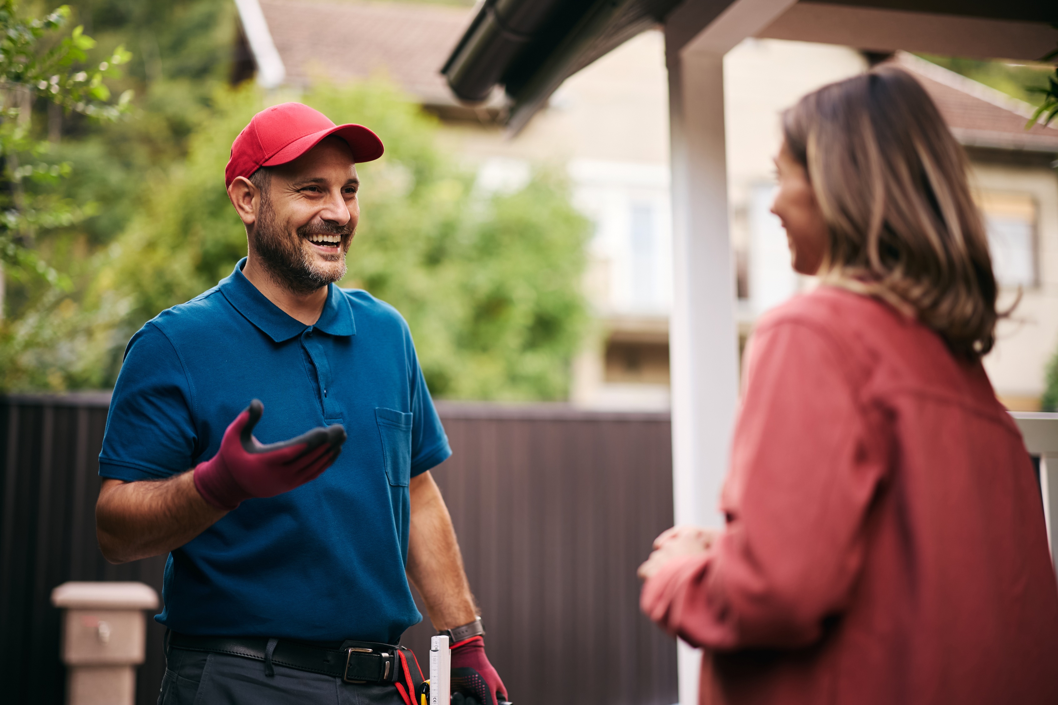 Contractor greeting homeowner at front door.