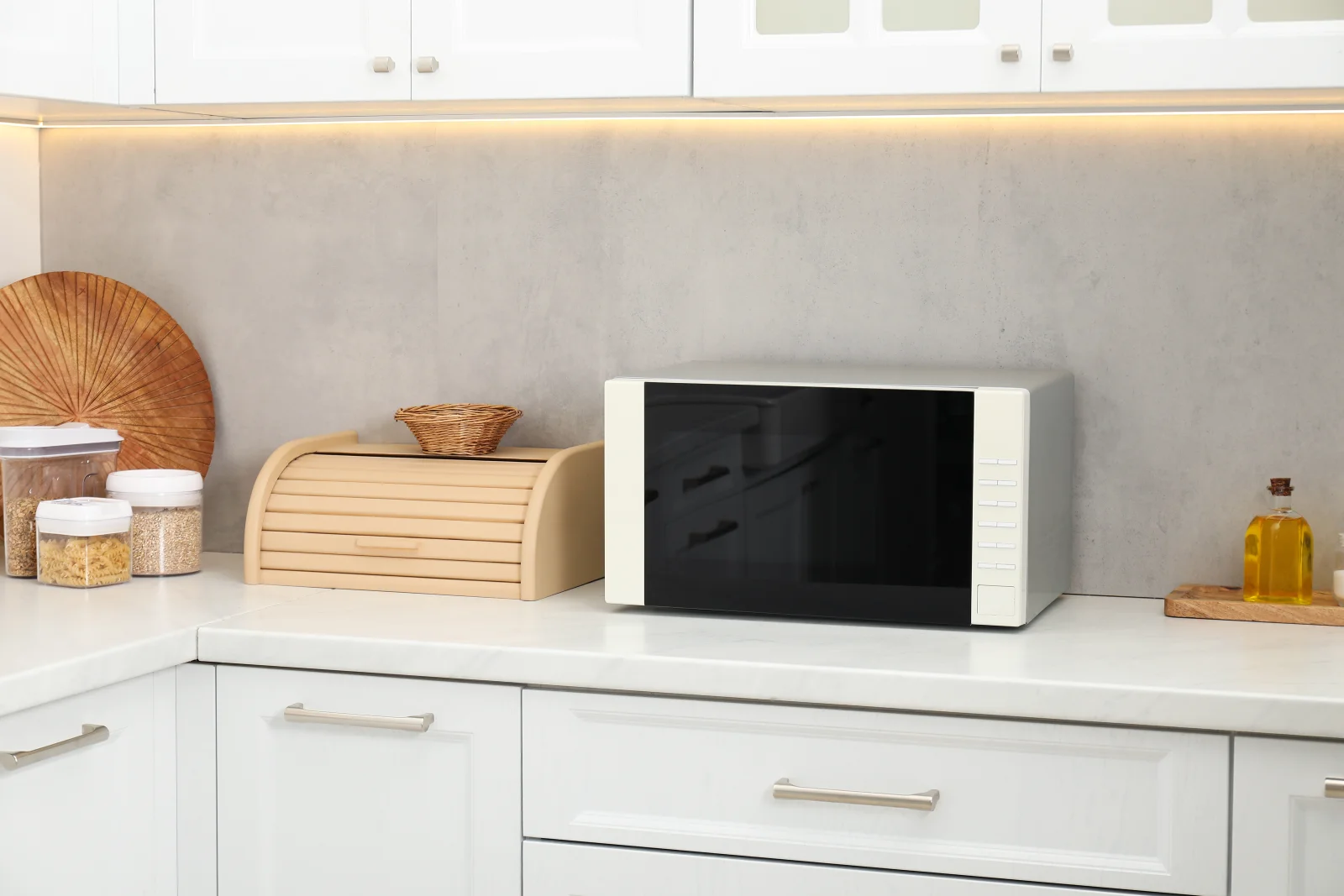 A countertop microwave on a kitchen counter in Phoenix, Arizona, the type of unit most homeowners call in for repair.