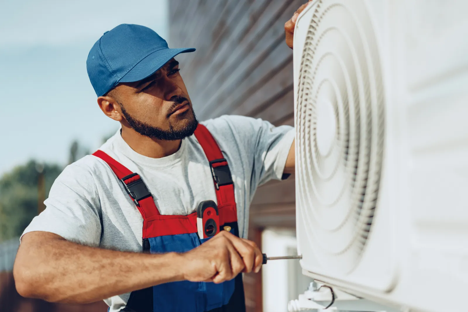mobile-home-ac-repair-phoenix-ac-unit Mobile Home AC Repair in Phoenix — an HVAC technician repairing an air conditioning unit at a Phoenix, Arizona manufactured home.