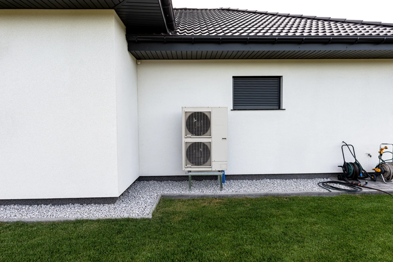 pool-heater-installation-phoenix-heat-pump-unit-installed Pool heater installation in Phoenix, Arizona — an outdoor heat pump pool heater unit installed beside a home.