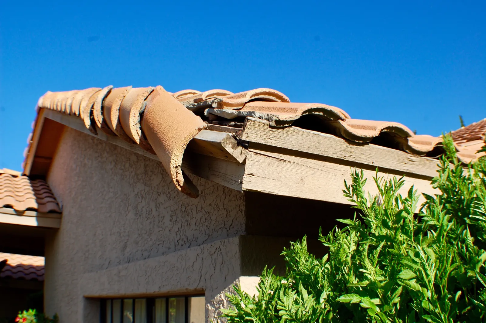 roof-storm-damage-repair-phoenix-repair Roof Storm Damage Repair in Phoenix — a roofer repairing storm-damaged roofing on a Phoenix, Arizona home.