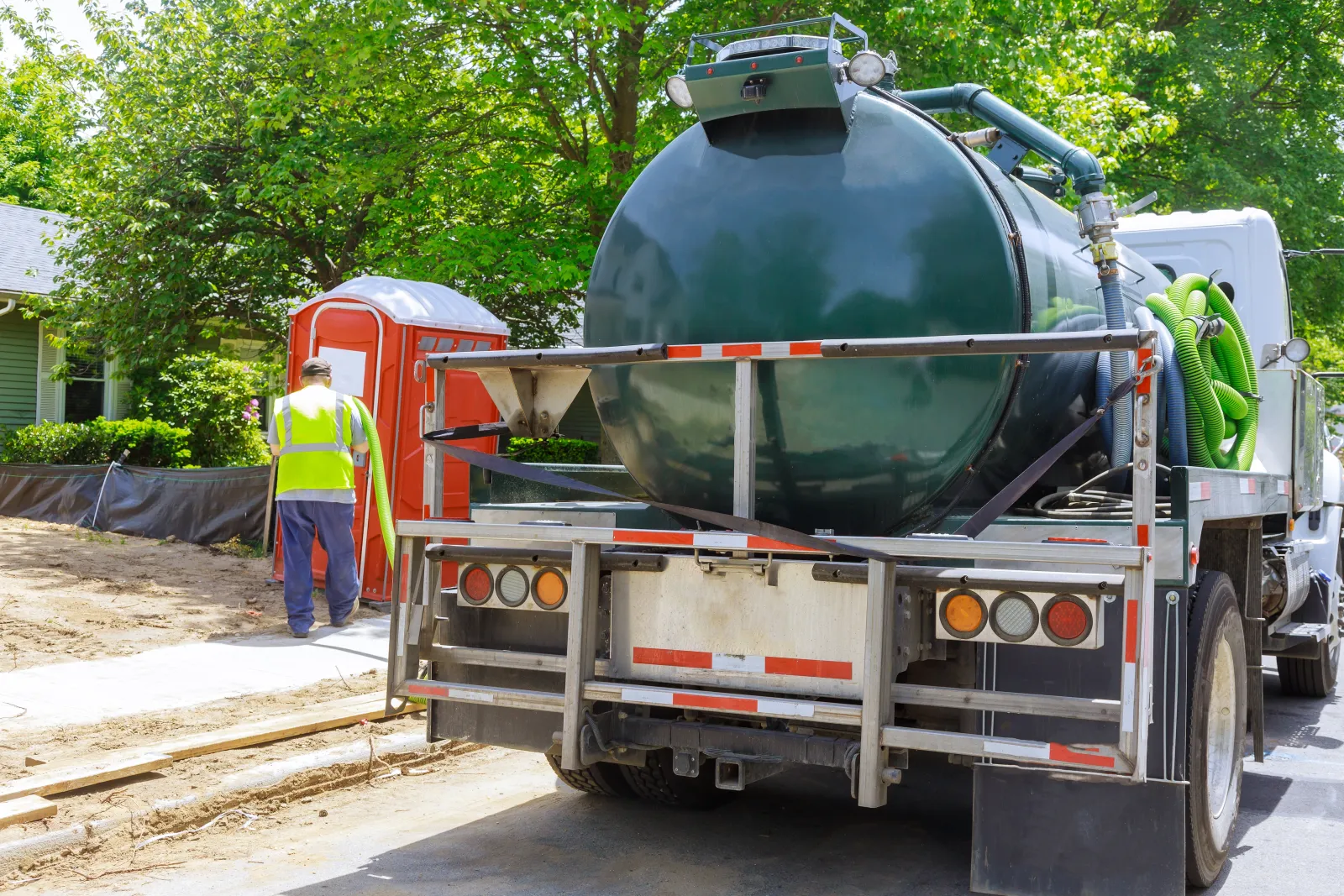 septic-pumping-phoenix-service-truck A septic service truck parked in a Phoenix-area neighborhood, one of the Valley communities where ShowUp Promise connects homeowners with a septic pumping pro.