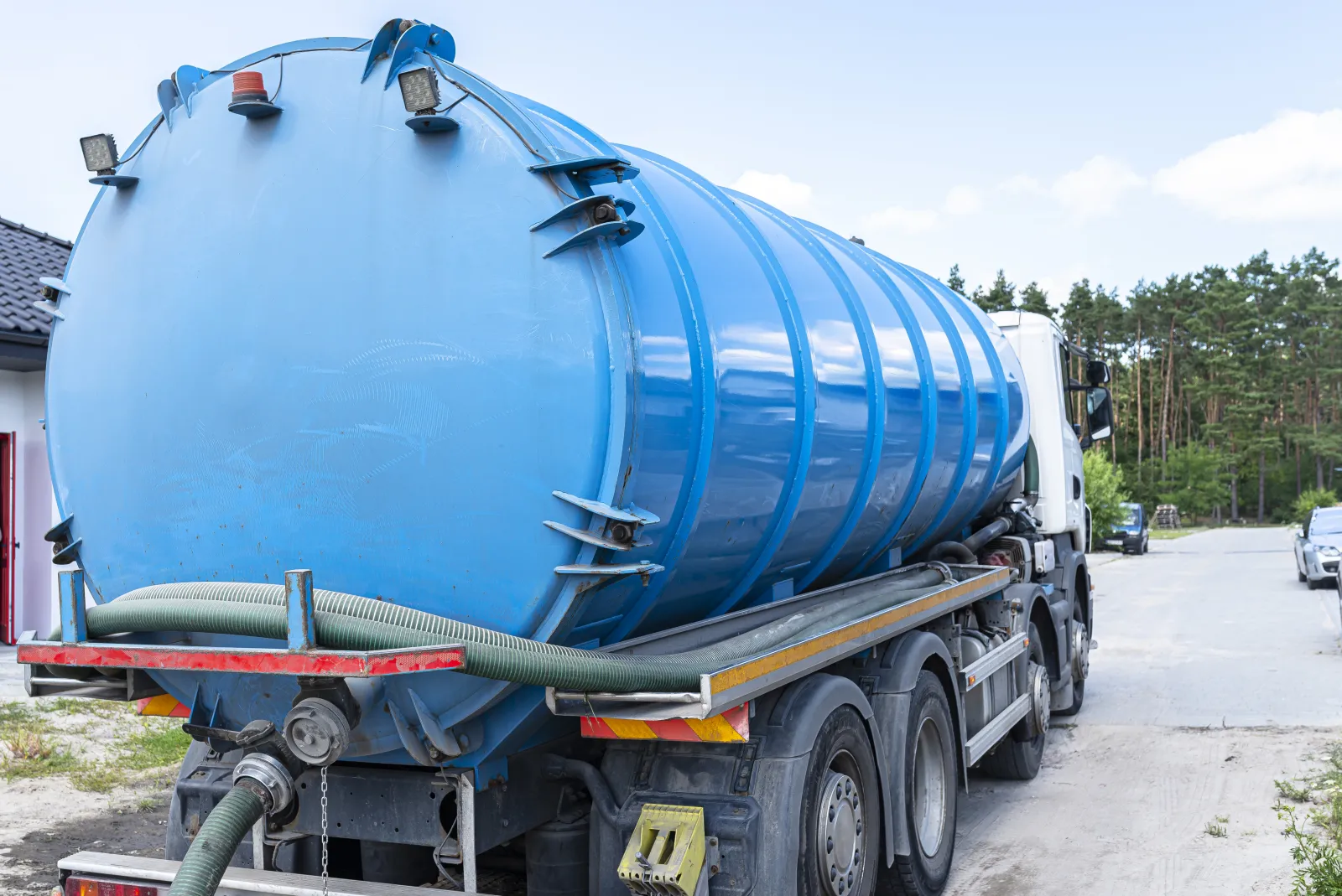 septic-pumping-phoenix-vacuum-truck A septic pumping truck drawing waste from a residential tank at a Phoenix home, the kind of service ShowUp Promise connects Valley homeowners with when a tank needs pumping.