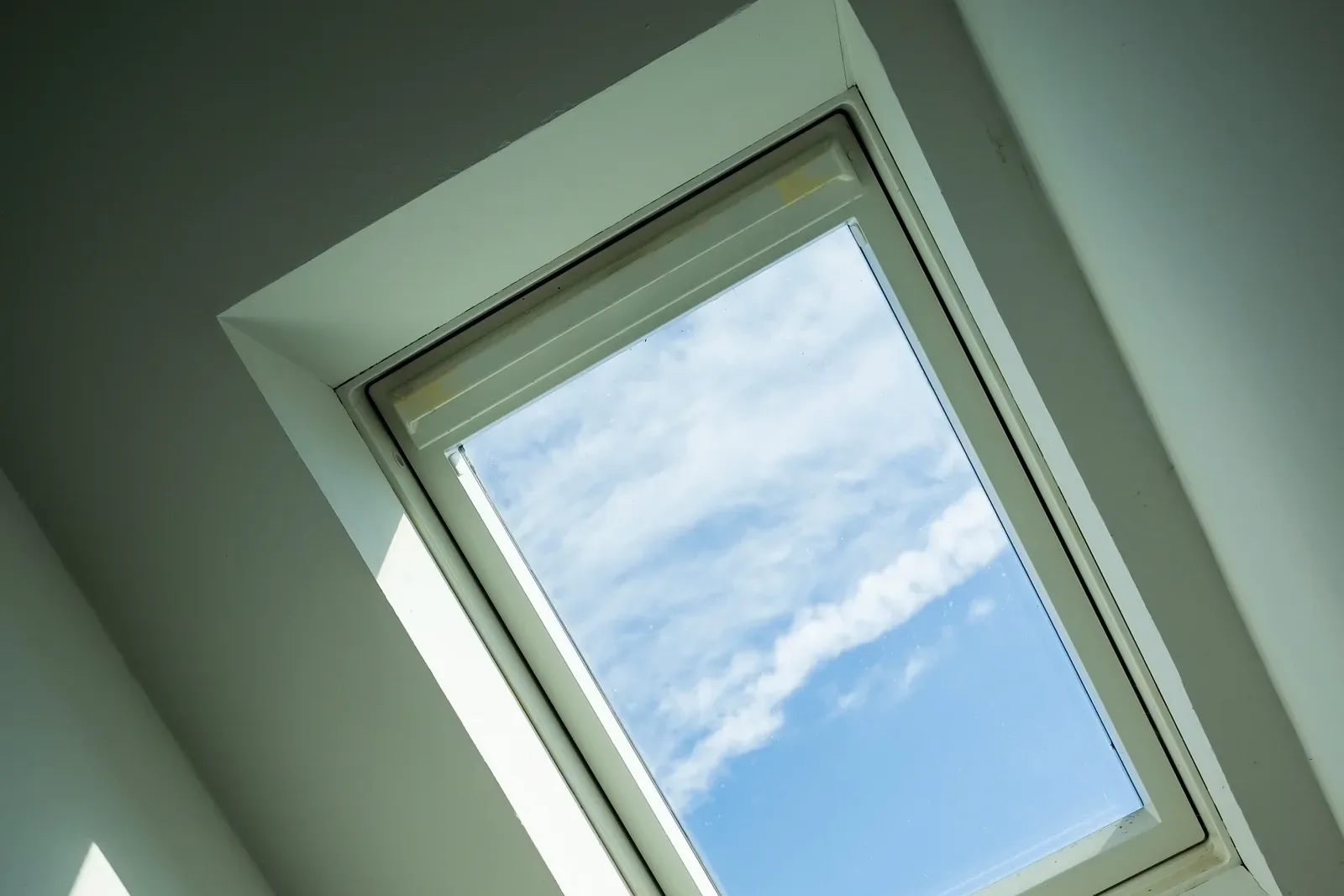 Skylight installation in Phoenix, Arizona — a finished Low-E glazed skylight showing clear blue desert sky.